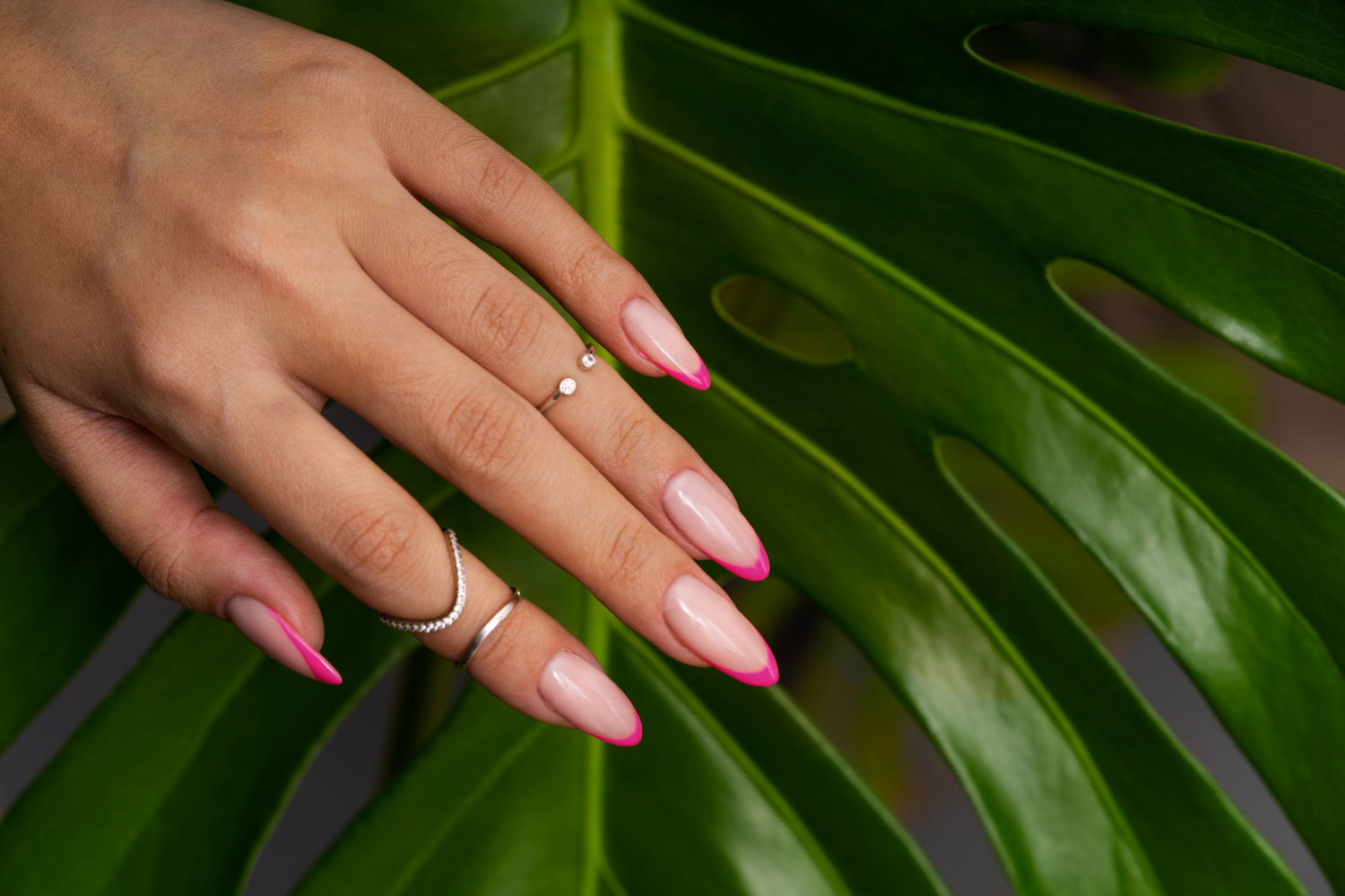 woman-showing-her-nail-art-fingernails-against-monster-leaf (2)